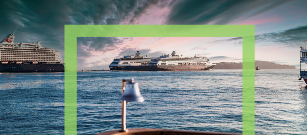 Two cruise ships and some other water vessels sail under cloudy weather