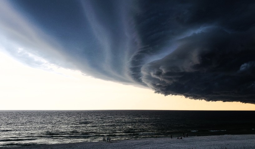 A hurricane forming in the sky above the sea