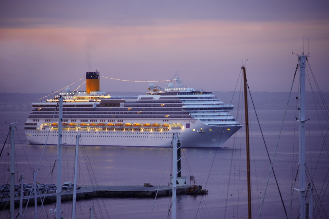 A large cruise ship near a dock